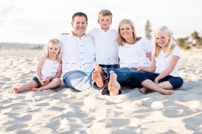 600557_stock-photo-happy-caucasian-family-portrait-at-the-beach