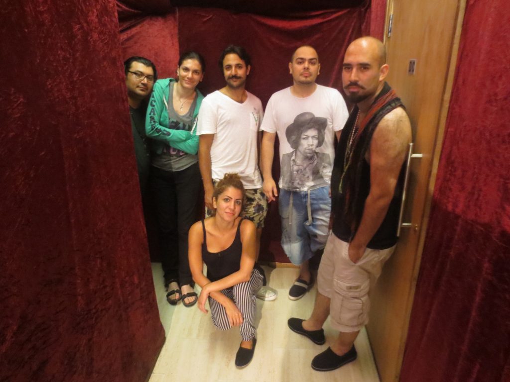 Ajam band's five formal members, not including a rotating cast of Iranian musicians who perform on recordings and tours. Pictured here (from right to left) are current performing members: Amin Ajami, Nari-Man, Parham Ajami, Shohreh Khatoon, Sara Fotros, and Arash Fayyazi. Zartosht Zafari, not pictured here, is also a member. (Photo: Kamyar Jarahzadeh)