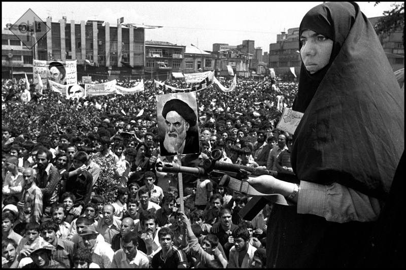 Woman guards crowds in Tehran in 1979. Photo: Alfred Yaghobzadeh