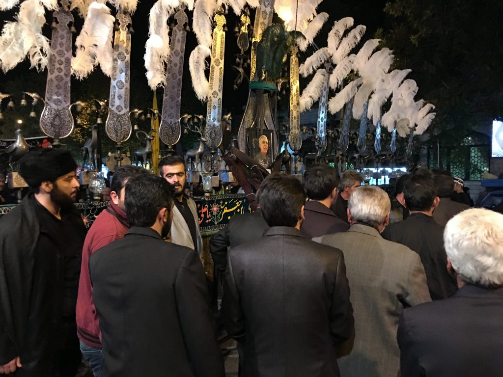 An 'alam (plural 'alamāt) is a stylized battle standard that is uses to symbolized the standards of Husayn at Karbala. Every neighborhood and mosque has its own standards which are carried in turn by the strongest members of each using a special harness, one person at a time. As they can weigh several hundred kilos, lifting and carrying them is a test of one's strength and endurance. Taken in Qazvin.