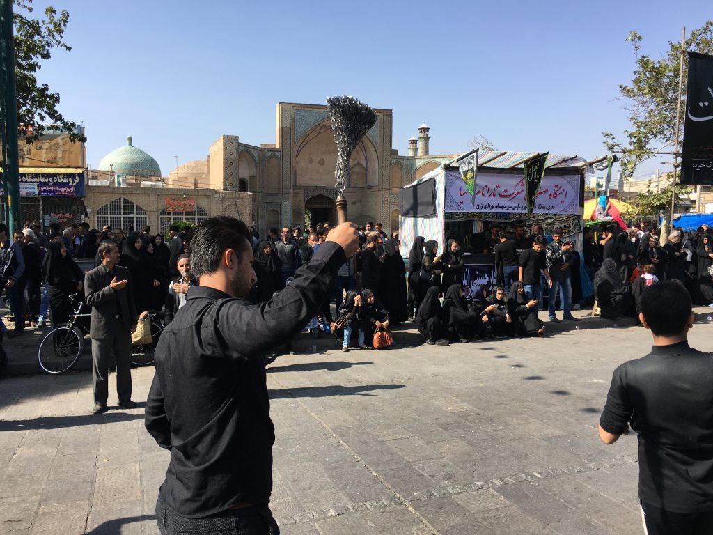 On the day of Ashura, the processions take to the streets all day. Pictured: man in mourning, hitting his back with a set of chains as part of the procession in Qazvin.